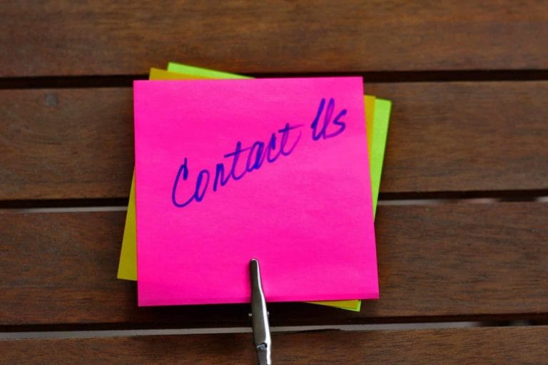 tour jp by monaka contact us handwritten pink sticky note on wooden desk inquiry support