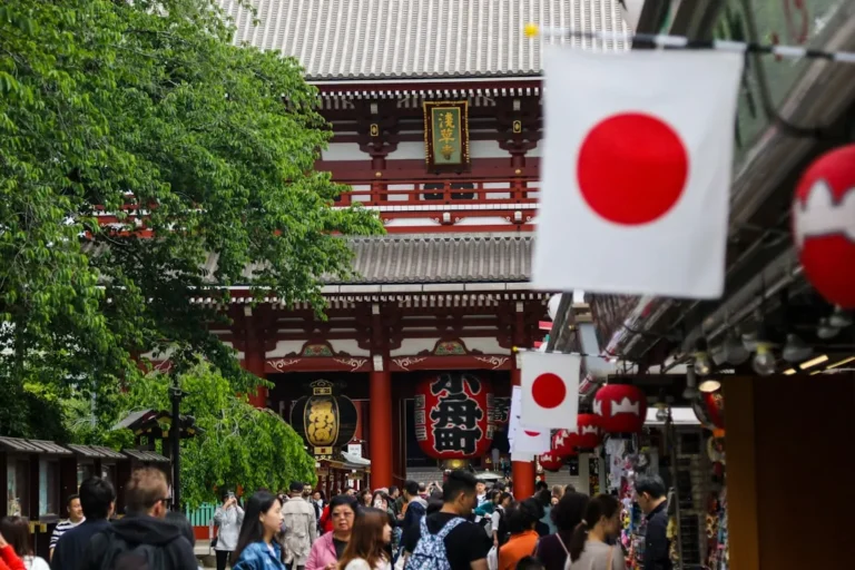 Golden hour illuminates Asakusa Temple as tourists respectfully navigate the bustling crowds, avoiding the initial rush hour chaos
