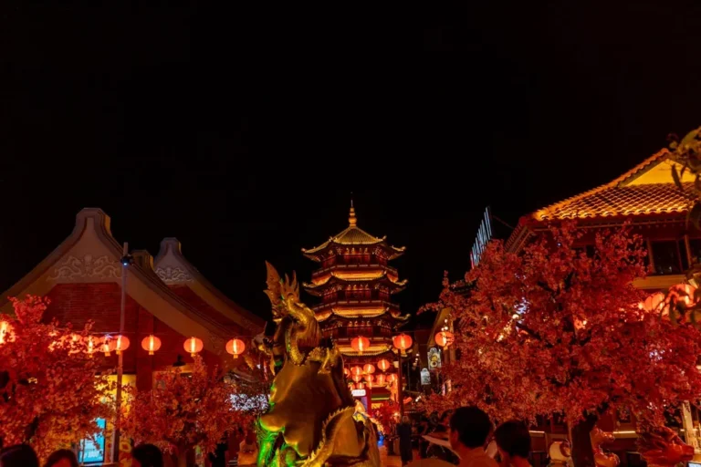 Golden morning sunlight bathes the serene facade of Asakusa Temple, as worshippers respectfully maintain physical distance amidst the vibrant neon glow of the city background