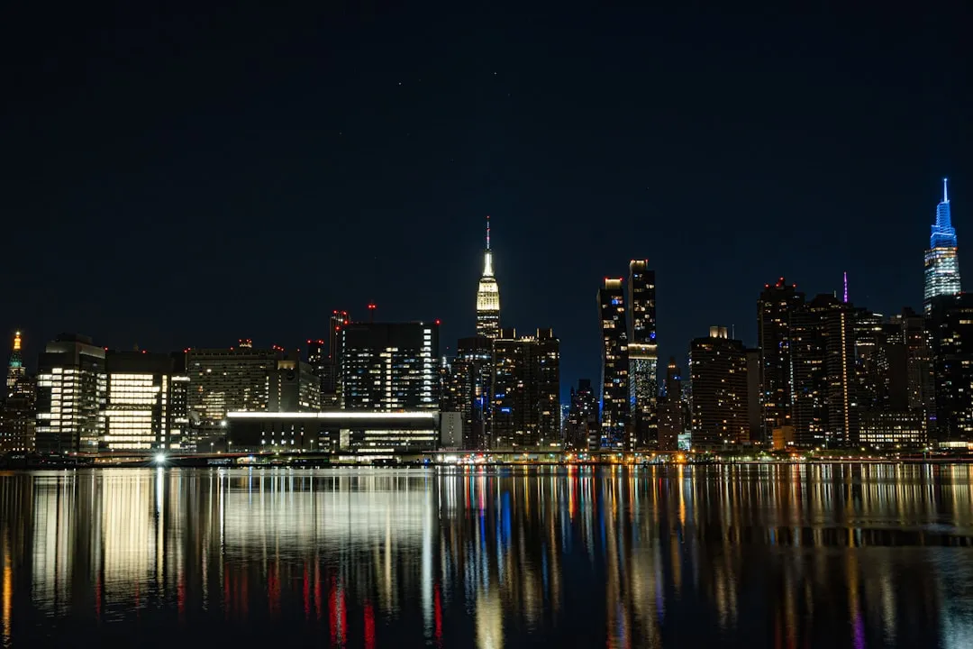 Vibrant city skyline reflected in a smartphone screen at night, Tokyo, Japan